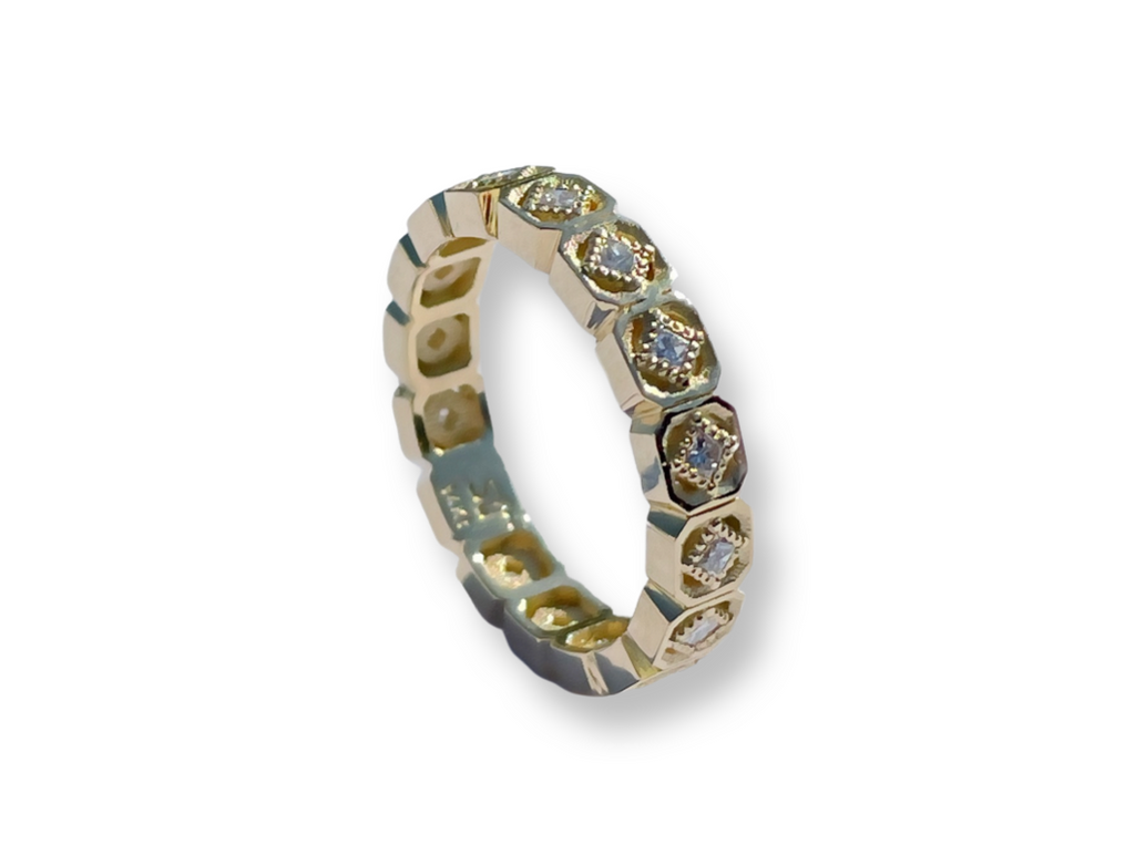 Geometric shaped eternity ring with diamonds